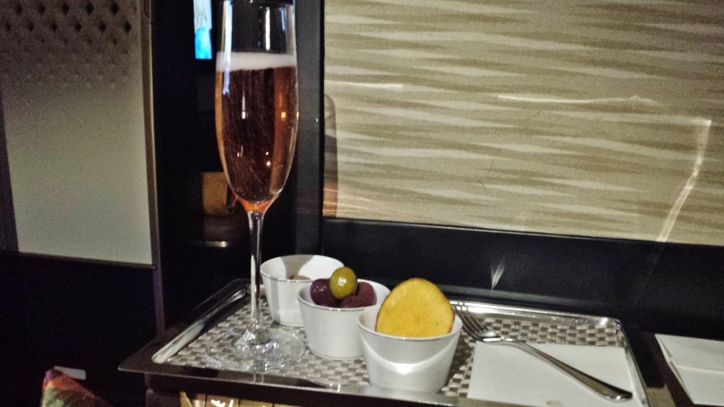 Etihad Airways First Apartment AUH-JFK post take off drink and snacks