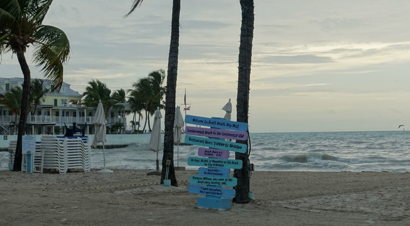 a sign on a beach