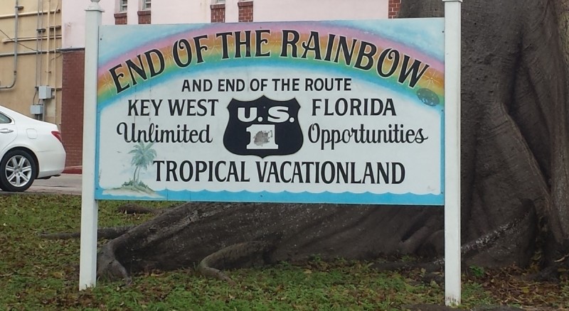 a sign in front of a tree