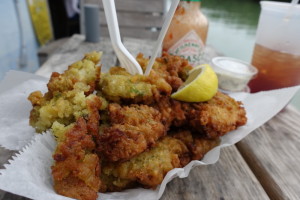 a plate of fried food with two forks