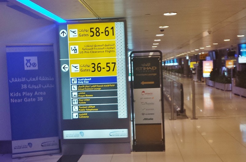 etihad premium lounge abu dhabi terminal 3 signage