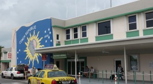 a yellow taxi cab outside of a building