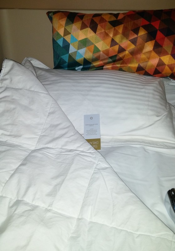 a white bedding with a white blanket