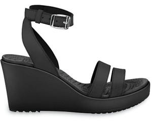 a black wedge sandal with a silver buckle