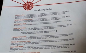 a menu with a sun and text