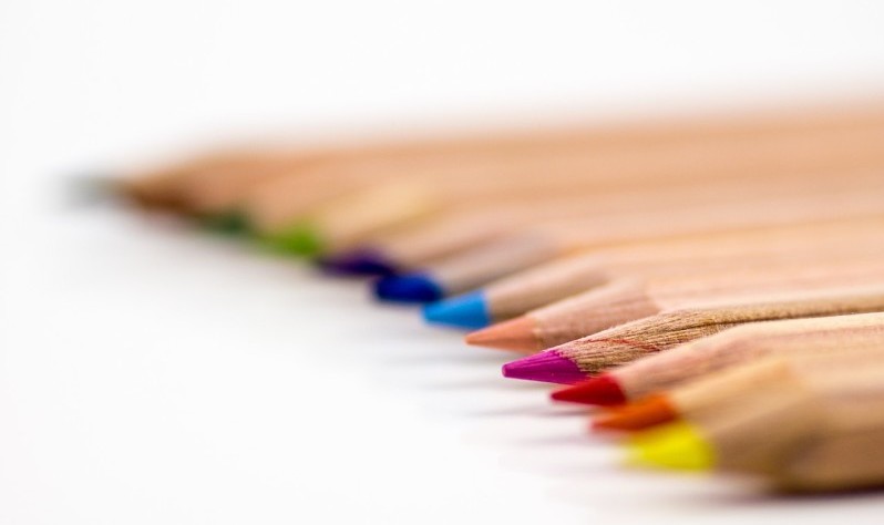 a row of colored pencils