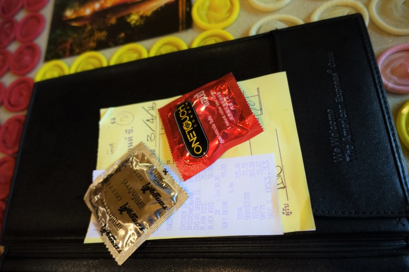 a condom on a black wallet