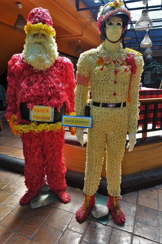 a couple of statues of men wearing clothing