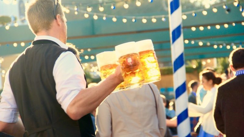 a man holding a mug of beer