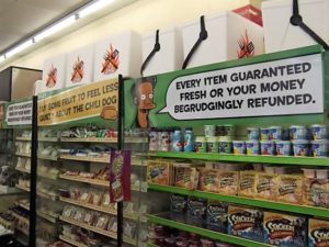 a store with a sign and shelves of food