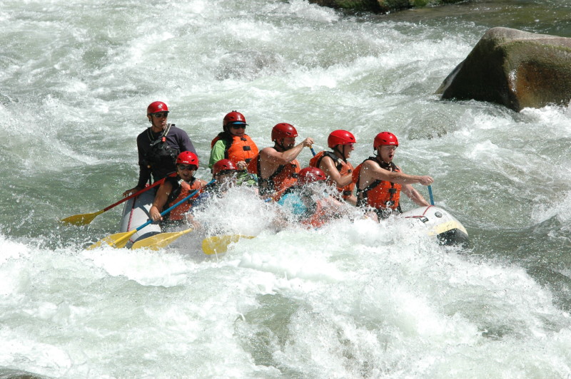 a group of people in a raft