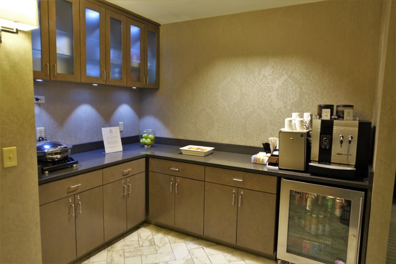 a kitchen with a black counter top