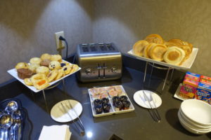 a table with plates of food and a toaster