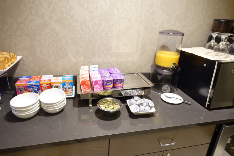 a table with food and juice dispenser