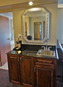 a mirror above a sink