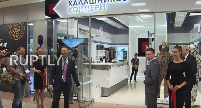 a group of men in suits walking through a store