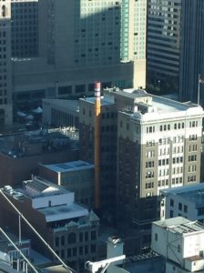 a tall building with a chimney