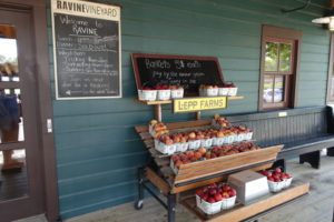 a display of apples on a bench