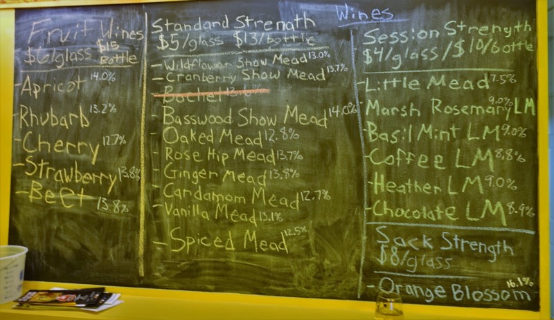 a chalkboard with a list of food