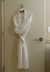 a white robe on a door