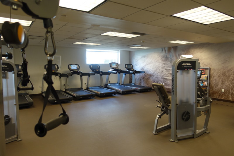 a room with treadmills and exercise equipment