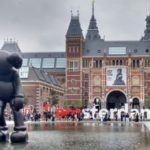 a large statue in front of Rijksmuseum