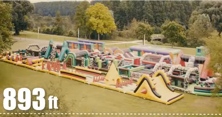 a large inflatable playground on a river