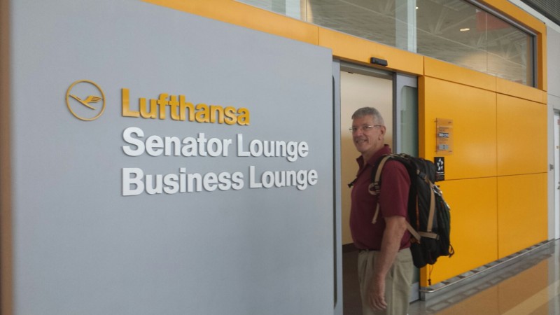 a man standing in front of a sign