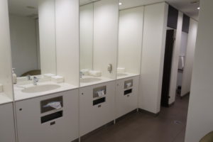 a bathroom with sinks and mirrors