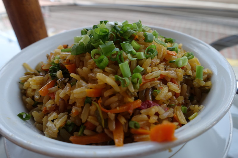 a bowl of rice with vegetables