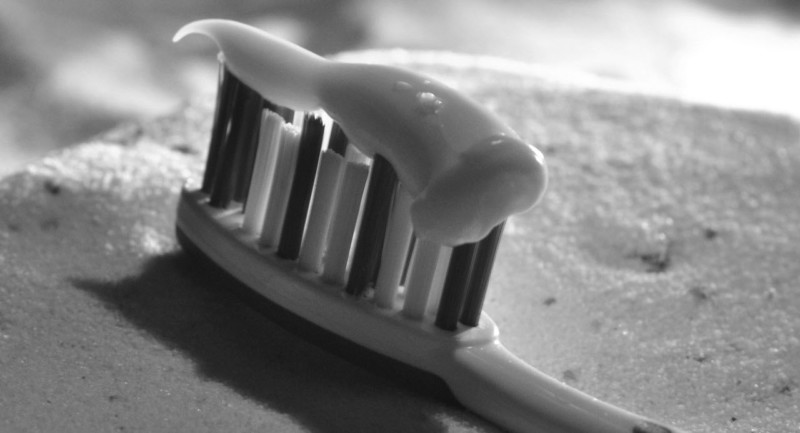tooth toothpaste on a toothbrush
