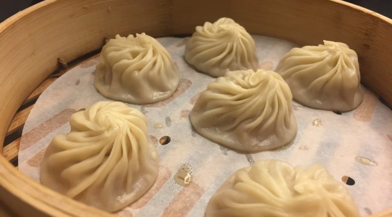 a group of dumplings on a tray
