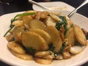 a plate of food with a spoon