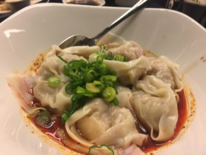 a bowl of food with a spoon