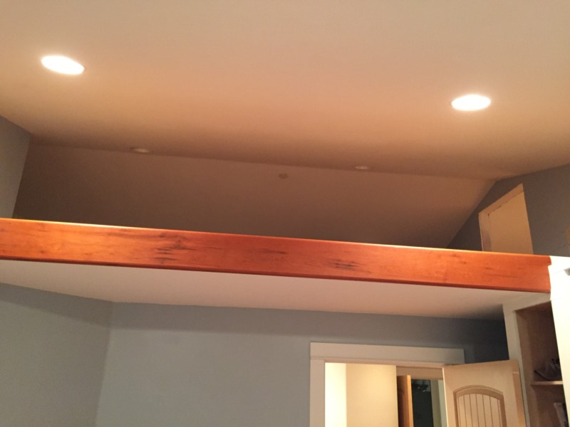 a wooden beam above a door