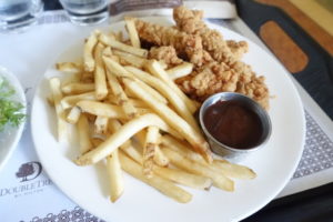 a plate of fried chicken and french fries