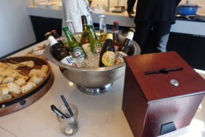 a bowl of beer and bread on a table