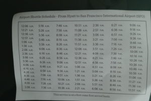 a shuttle schedule on a black surface