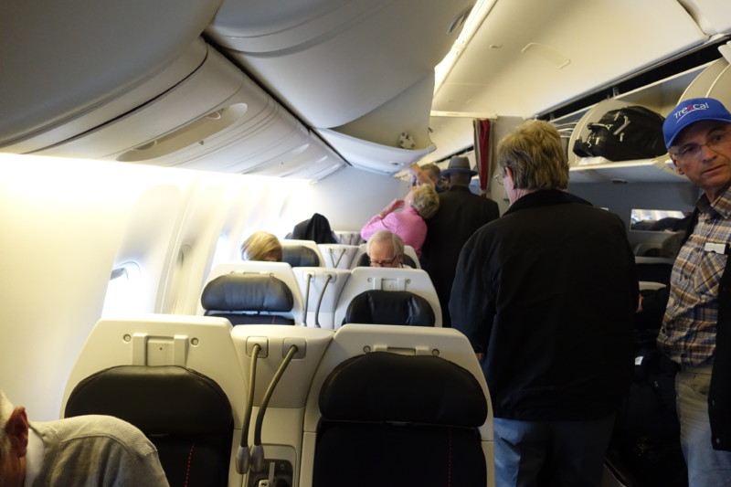 people in an airplane with people on the seats