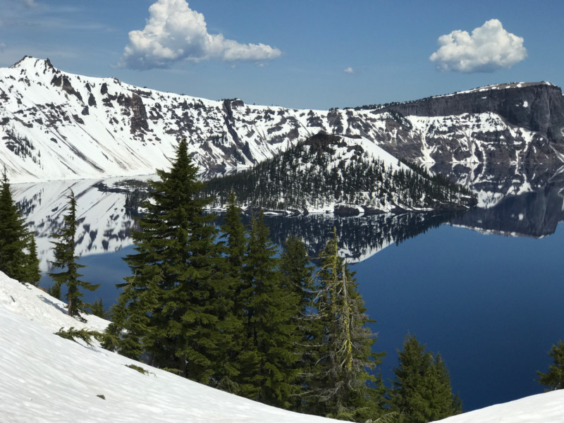 a snow covered mountains and a body of water