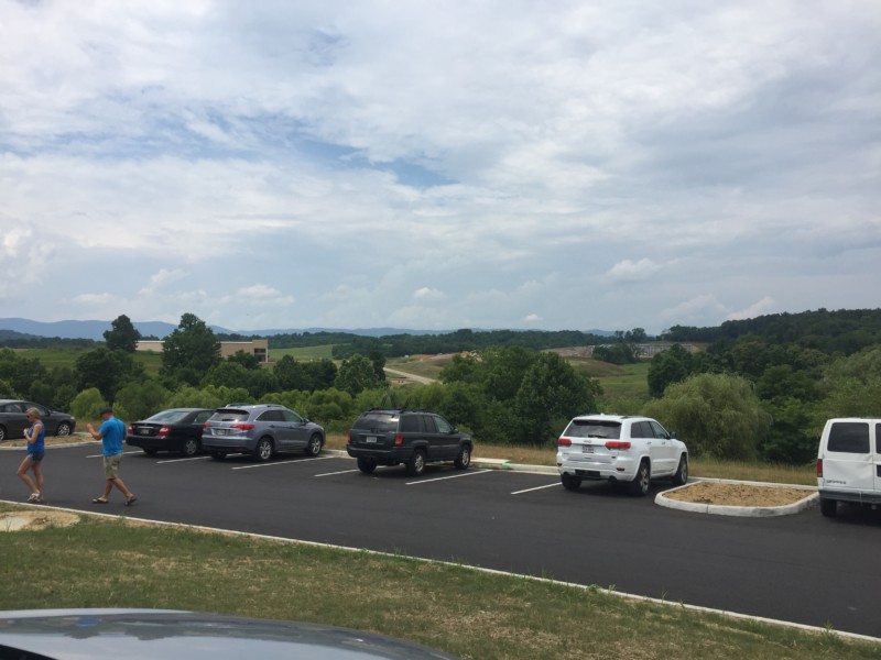 a man walking in a parking lot