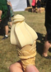 a hand holding an ice cream cone