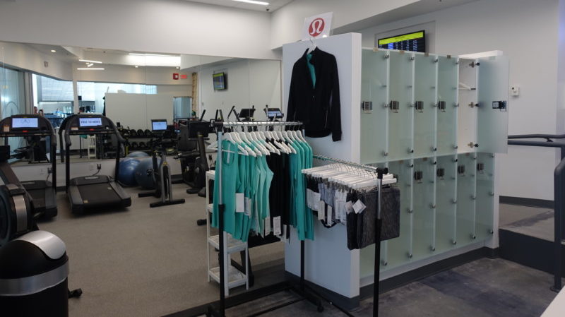 a room with gym lockers and clothes