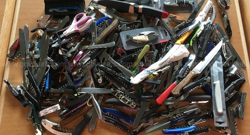 a large pile of multi-tool knifes