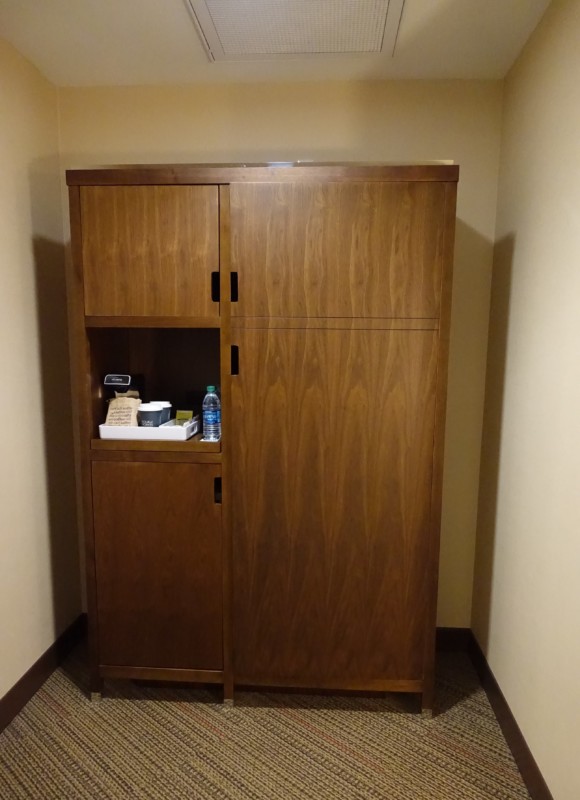 a wooden cabinet in a room