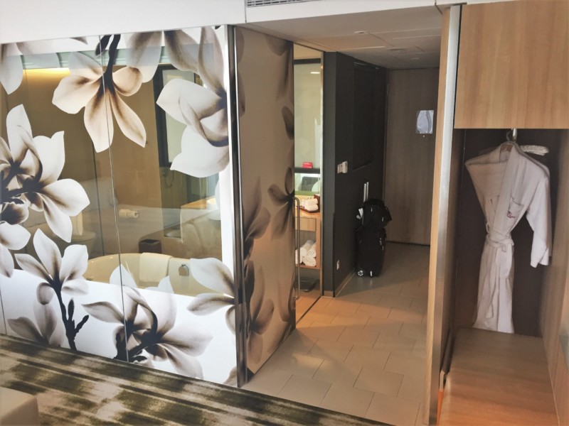 a room with a glass door and a towel on it