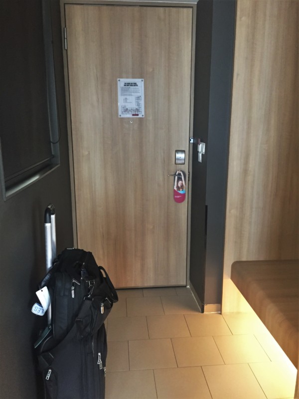 a door with a bag on the side