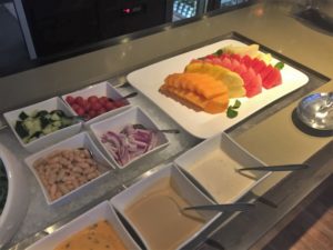 a plate of fruit and vegetables on a counter