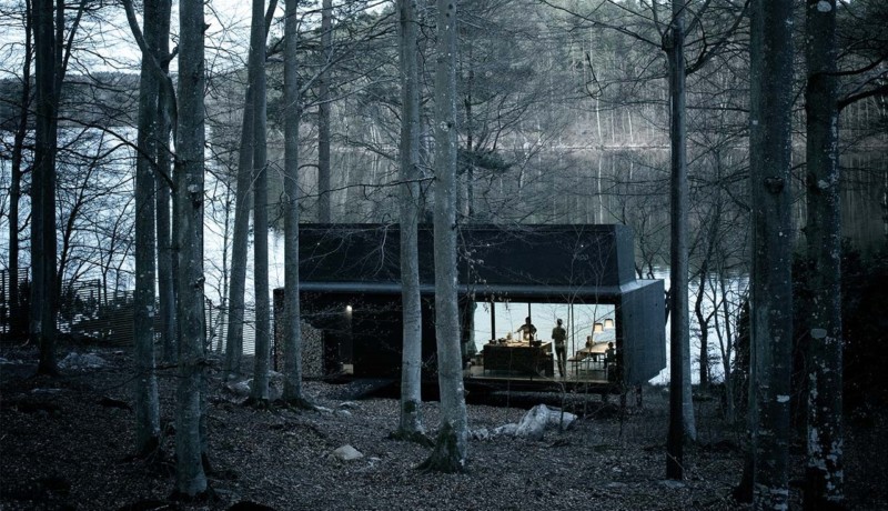 a black building in the woods