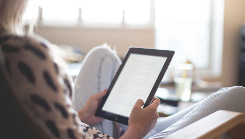 a person holding a tablet